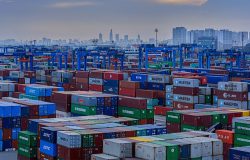 Shipping containers at a port in Ho Chi Minh City. Photo by Shutterstock/Igor Grochev.
